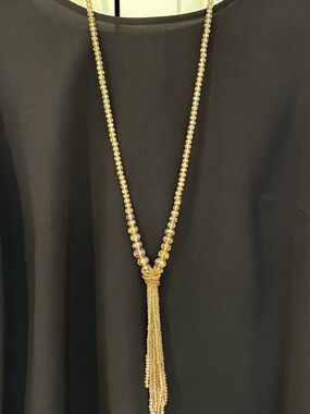 Beaded lariat necklace with multi-strand fringe tassel wrapped knot